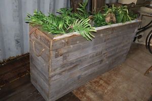 lot 129 image: Decorative wooden plant box - 61.5X17x31.5, does have small wheels on bottom.