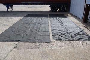 lot 147 image: Two black tarps (about 6x16 and 4x16)
