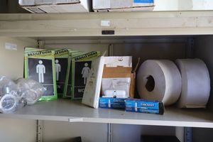 lot 226 image: Bathroom signs, spring door closers, shower curtain liner, TP