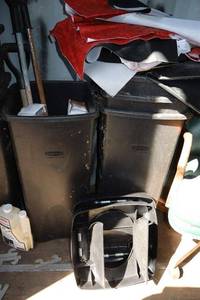 lot 209 image: Rubbermaid trash bins and extra chair seats, bathroom bars
