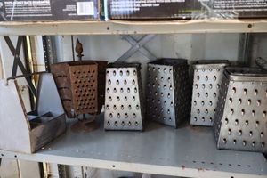 lot 12 image: Metal table dcor in kitchen grater style