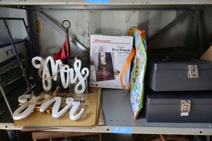 lot 16 image: Travel money boxes, MR. and MRS. Wood signs and more dcor