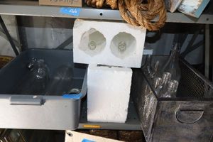 lot 21 image: Decorative table bottles - clear glass bottles and dish bin