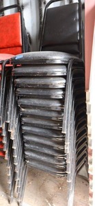 lot 157 image: Stackable black cushion chairs with metal frame - 12 total