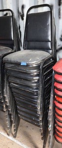 lot 159 image: Stackable black cushion chairs with metal frame - 12 total