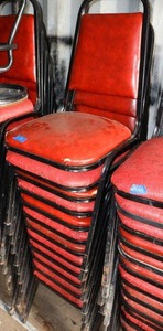 lot 162 image: Stackable red cushion chairs with metal frame - 12 total