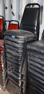 lot 169 image: Stackable black cushion chairs with metal frame - 13 total