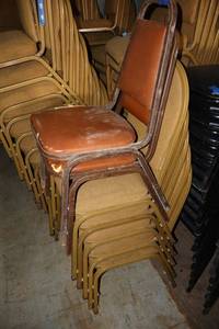 lot 179 image: Stackable brown and gold cushion chairs with metal frame - 7 total