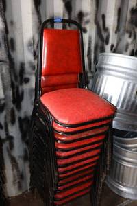 lot 204 image: Stackable red cushion chairs with metal frame - 12 total