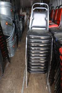 lot 205 image: Stackable black cushion chairs with metal frame - 12 total