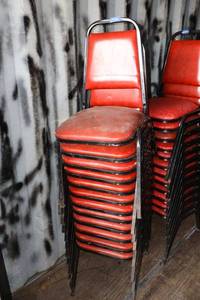 lot 206 image: Stackable red cushion chairs with metal frame - 12 total