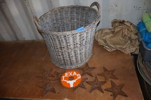 lot 57 image: Basket with cast iron stars and Texas Longhorn painted saw blade