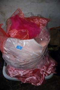 lot 36 image: Mixed pinks table linens  decorative ribbons