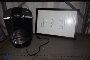 lot 40 image: Keurig coffee maker and 11x17 picture frame