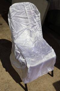 lot 63 image: White satin chair covers - about 20 count plus table linens