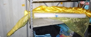 lot 100 image: White and yellow fabric rolls, satin and sheer
