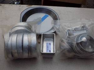 lot 24 image: various cake pans all sizes plus oval and square as well