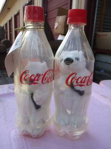 lot 165 image: COCA COLA BOTTLE BANKS WITH BEARS IN THEM