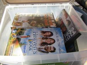 lot 101 image: DOG FOOD CRATE FULL OF DVD MOVIES