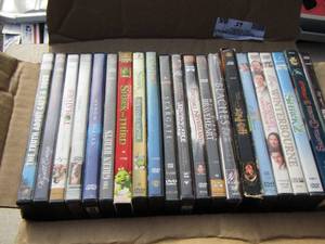 lot 65 image: large lot of dvds, Shrek, beaches, stargate. Tomatoes cat and dog plus