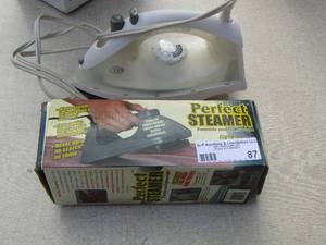 lot 87 image: new in box steamer and used iron