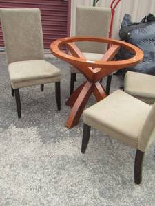 lot 5 image: ROUND DINING ROOM TABLE HAS GLASS, GLASS IS JUST STORED AND 4 NICE DINING CHAIRS