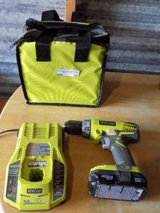 lot 74 image: RYOBI DRILL WITH TOOL BAG, BATTERY CHARGER, AND BATTERY