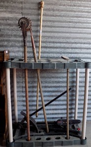 lot 173 image: YARD TOOLS   ( HAND EDGER, FLAG POLE, CHAIN SAW ATTACHMENT) AND YARD TOOL HOLDER