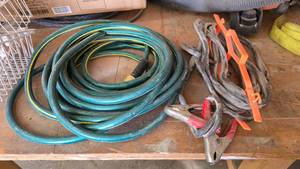 lot 213 image: Garden Hose & Long Jumper Cables w Cord Reel