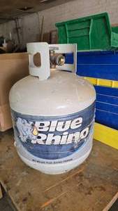 lot 216 image: Blue Trhino Propane Tank.  Feels full