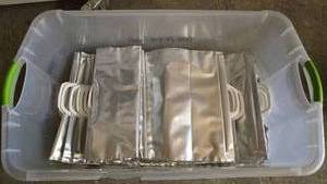 lot 339 image: Large Tote w Clamp Seal Gift Bags.  Approx 70 Bags