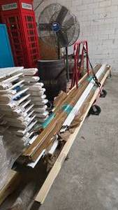 lot 27 image: Large Lot of Misc Trim & Molding Boards.  Includes Red Rolling Cart