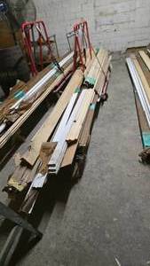 lot 28 image: Large Lot of Misc Trim & Molding Boards.  Includes Red Rolling Cart