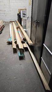 lot 424 image: Large Lot of Misc Baseboard & Trim Pieces.  Some boards are damaged.  BUYER MUST TAKE ALL