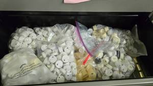 lot 93 image: Contents of Shelf.  MASSIVE Lot of Misc Votive Lights