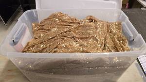 lot 127 image: Large Tote Full of Gold Sequin Table Covers