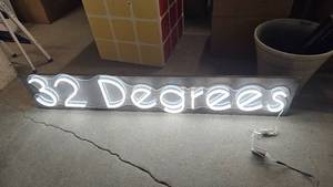 lot 180 image: LED 32 Degrees Sign w Wood Back