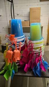 lot 318 image: 2 Large Stacks of Plastic Beach Pails.  Approx 50 Pails Total