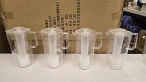 lot 707 image: Lot of 4 Clear Arcylic Pitchers w Built-In Ice Stick