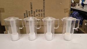 lot 708 image: Lot of 4 Clear Arcylic Pitchers w Built-In Ice Stick