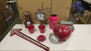 lot 771 image: Lot of Misc Red Themed Dcor Items.  Includes Vintage Football Helmet, Arrow, Desktop Clocks & More.  Includes Everything Pictured.