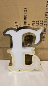 lot 790 image: Large Letter E Gold & White Channel Letter.  Can be wired for light.  Would make a great dcor piece