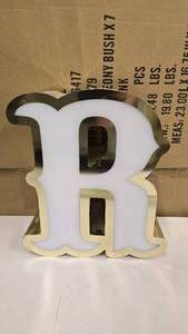 lot 791 image: Large Letter R Gold & White Channel Letter.  Can be wired for light.  Would make a great dcor piece