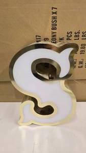 lot 792 image: Large Letter S Gold & White Channel Letter.  Can be wired for light.  Would make a great dcor piece