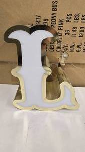 lot 793 image: Large Letter L Gold & White Channel Letter.  Can be wired for light.  Would make a great dcor piece