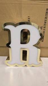 lot 795 image: Large Letter R Gold & White Channel Letter.  15 Tall.  Can be wired for light.  Would make a great dcor piece