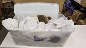 lot 956 image: Large Tote FULL of Christmas Tree Skirts.  Approx 7 Skirts Total