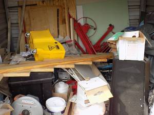 STORAGE UNIT - (M) DRYWALLERS UNIT-  RIDGID SAW, SPEAKERS, DRYWALL LIFT, JACKS, BLACK BOX, STRING, LADDER, PAINT, WOOD, TARP, LARGE TELEVISION(80??) PLUS