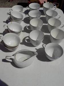 lot 200 image: silver rim handled coffee cups and creamer