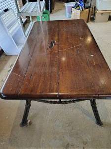lot 21 image: Solid wood coffee table with iron base